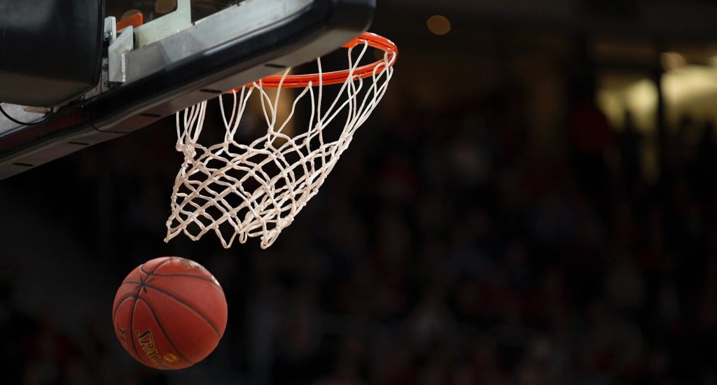 A basketball goes through the hoop